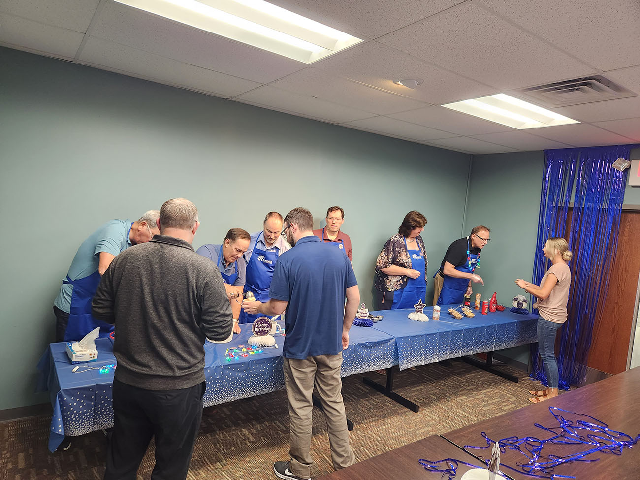 People visiting an ice cream sundae bar